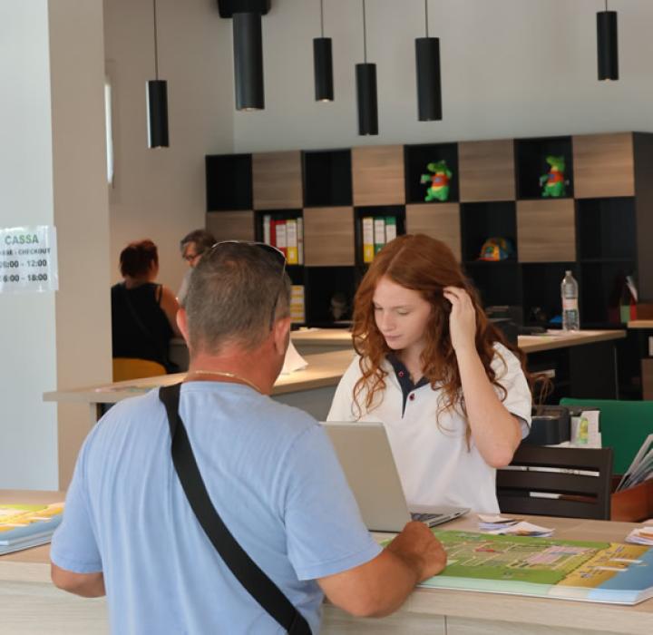 Modern reception, friendly conversation, welcoming and bright atmosphere.